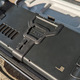 A Steam Deck with the Deckmate grip attached lays facedown in the case.